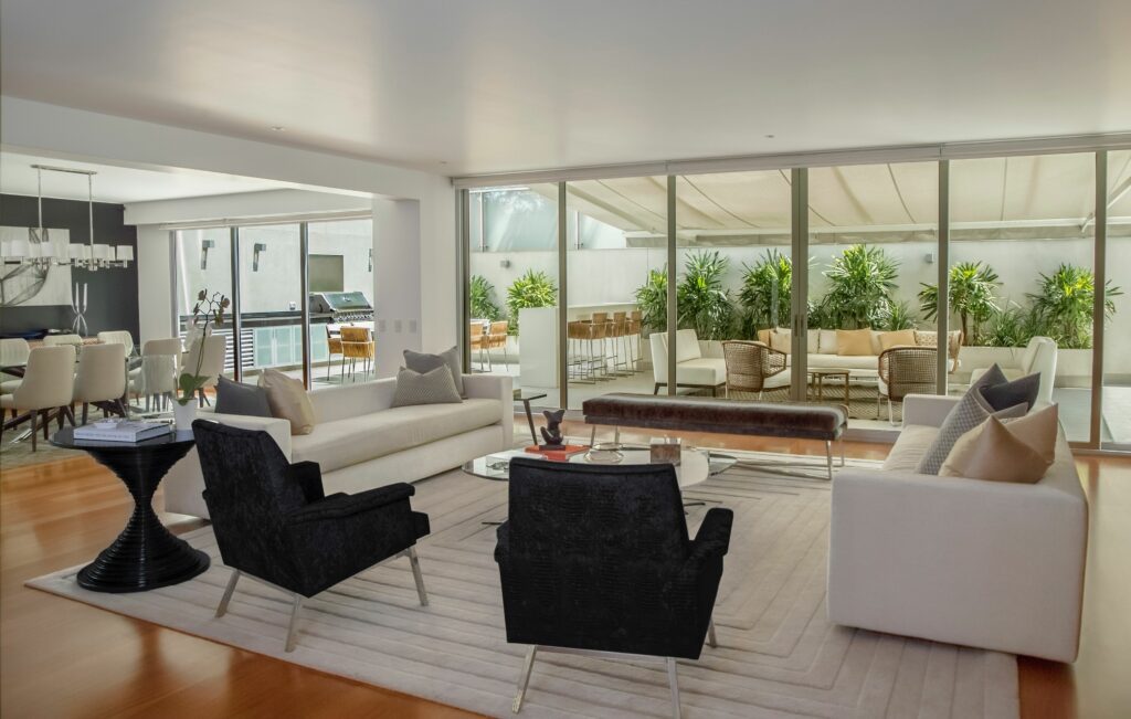 Large-drawing-room-with-couches-and-aluminium-doors-windows